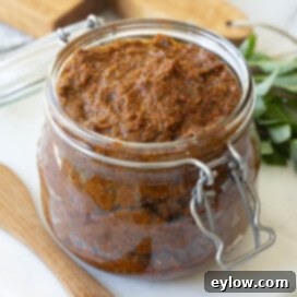 Crimson Sun Pesto 8 Glass jar of pesto rosso, red pesto, ready to enjoy.