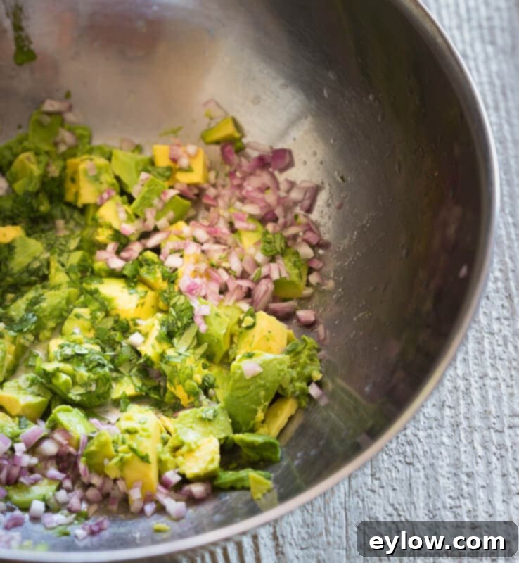 Guacamole Chicken Salad, presented in a bowl, showcasing its vibrant colors and inviting texture.