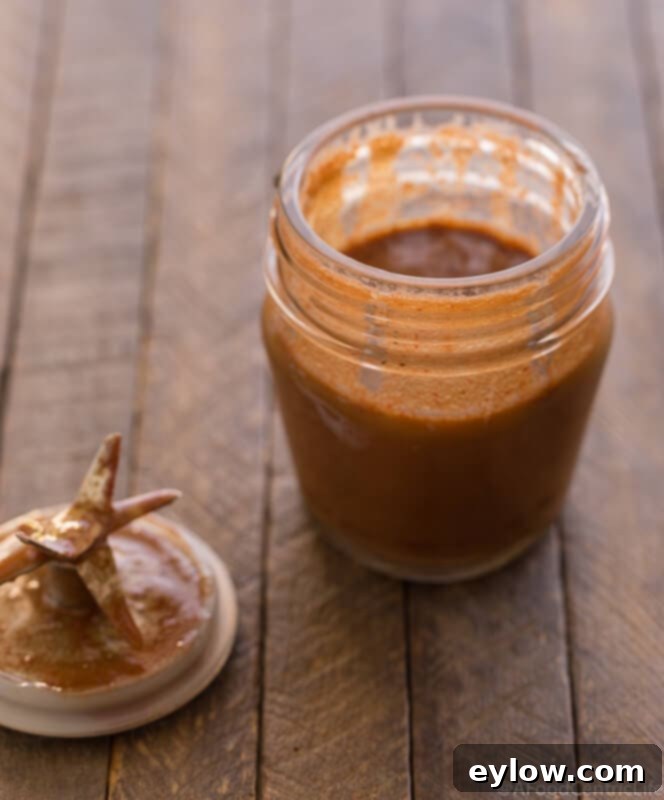 A container of the blended strawberry dressing.