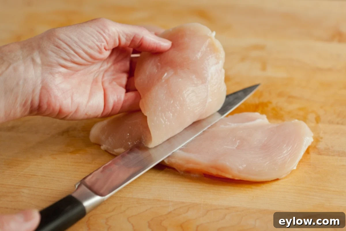A visual guide demonstrating how to expertly slice a chicken breast into thin, even cutlets.