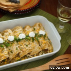 Zesty Roast Chicken Verde Enchiladas 4 Classic chicken enchiladas with tomatillo sauce, presented in a rustic dish, showcasing a perfect blend of savory chicken, vibrant green sauce, and melted cheese.