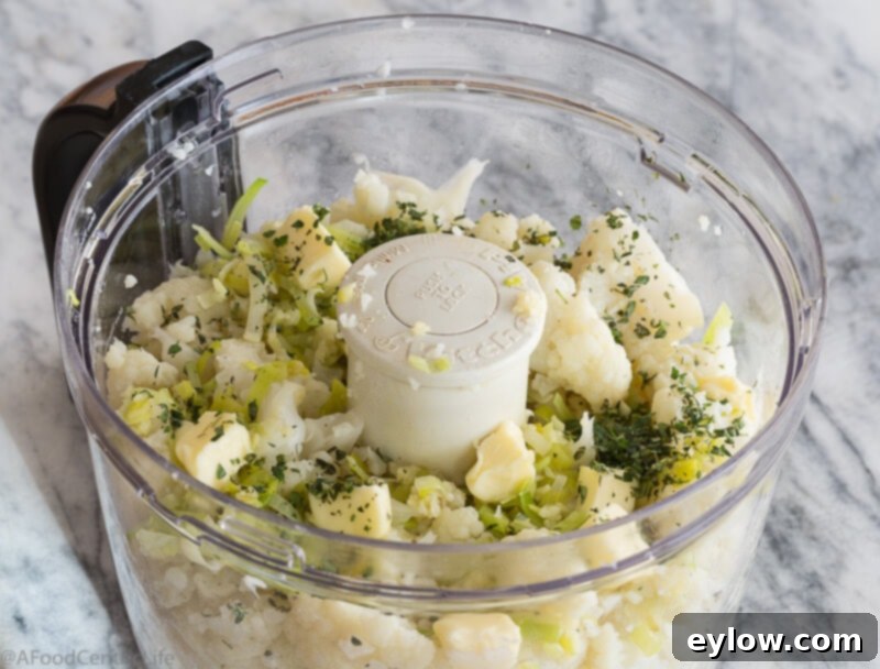 chunks of cauliflower ready for pureeing with herbs | AFoodCentricLife.com
