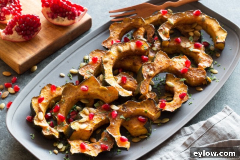 Maple roasted acorn squash on a serving platter, ready to be enjoyed.