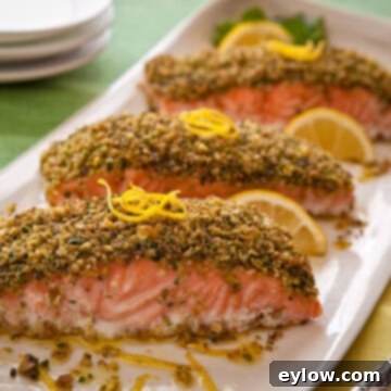 Crunchy Pistachio Salmon Bake 3 Pistachio crusted roast salmon on a white platter, ready to serve.
