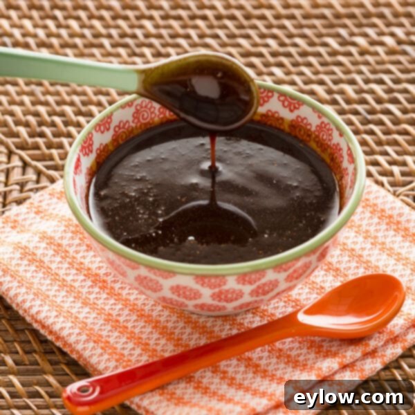 Hoisin-Glazed Golden Scallops 3 A bowl of rich, dark Hoisin sauce, perfect for glazing and dipping.