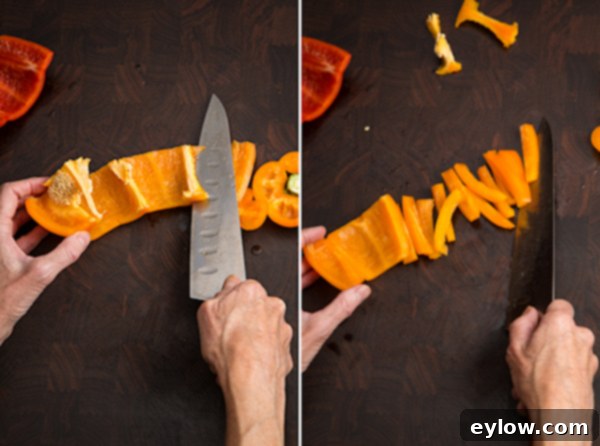 Chopping bell peppers into strips after initial preparation.