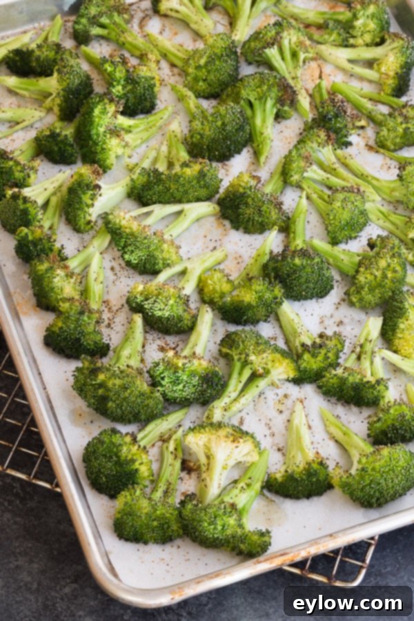 Roasted broccoli florets on a baking tray