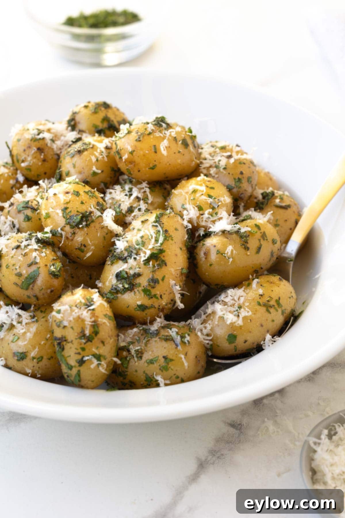Golden Buttered Potato Gems 2 Baby Dutch yellow potatoes with herbs and parmesan.