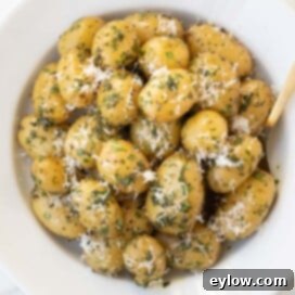 Golden Buttered Potato Gems 9 Baby dutch yellow potatoes wtih herbs and Parmesan cheese.