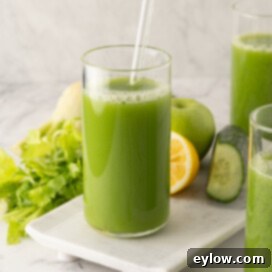 Glasses of bright green, healthy cucumber, celery vegetables juice.
