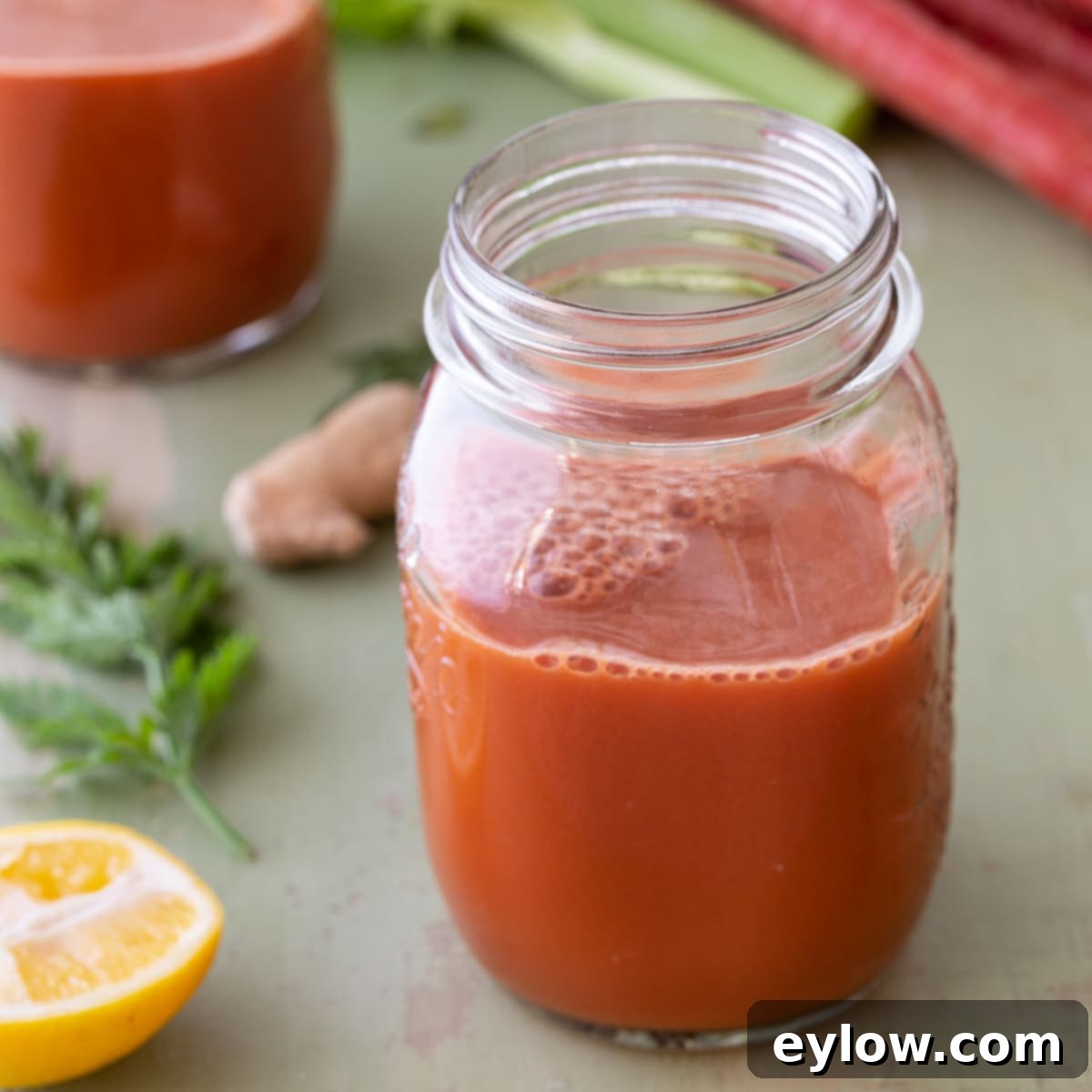 carrot celery morning glow juice in a glass jar. 