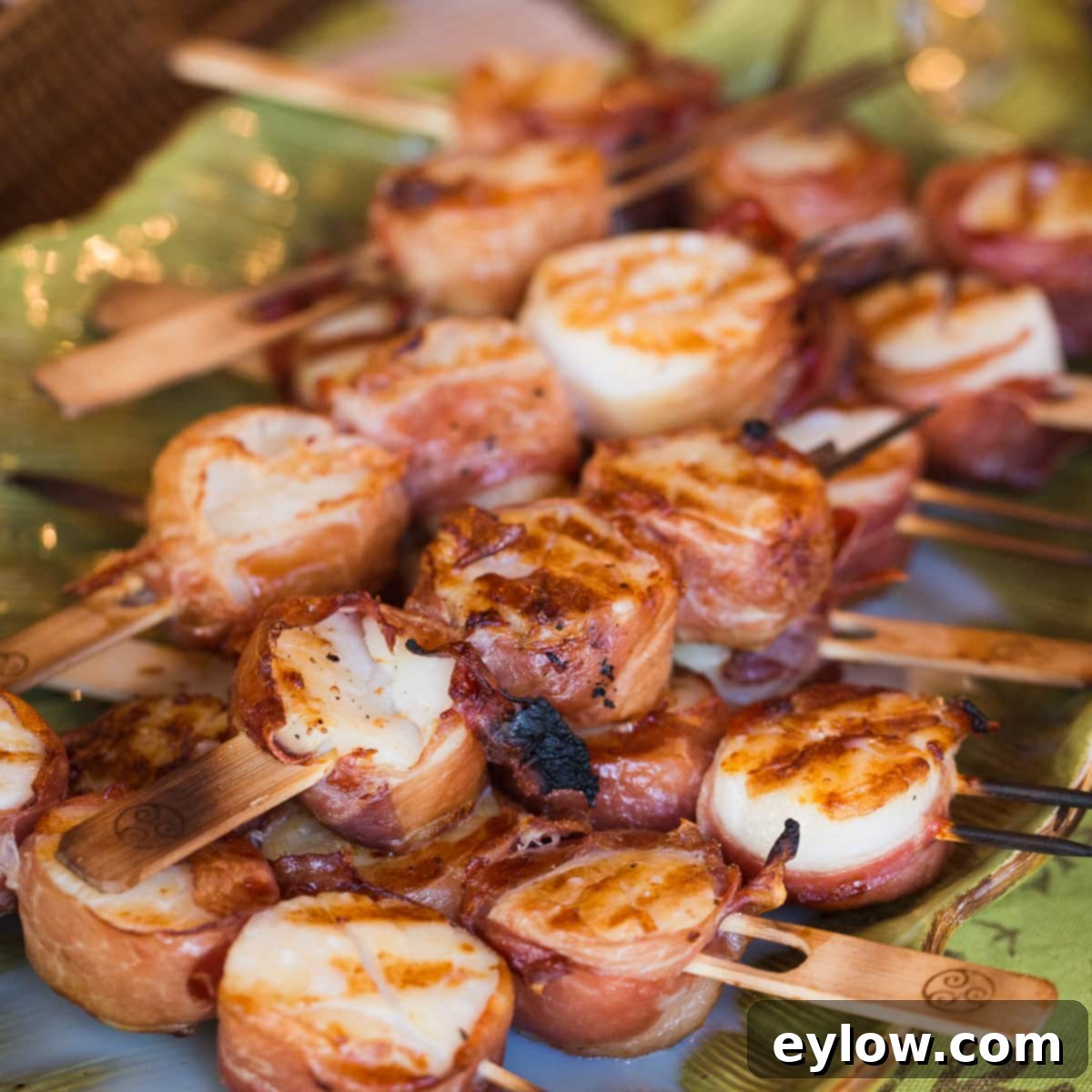 Luscious Mango Sauce 3 Grilled scallops wrapped with prosciutto and mango sauce.