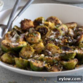 Zesty Lemon and Thyme Brussels Sprouts 6 Sauteed Brussels sprouts with lemon and thyme, garnished with fresh herbs and cheese.