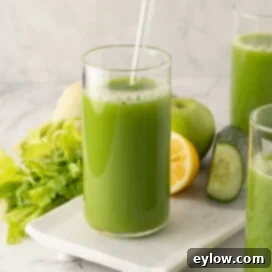 Crisp Green Elixir 9 Glasses of bright green, healthy cucumber, celery vegetables juice.