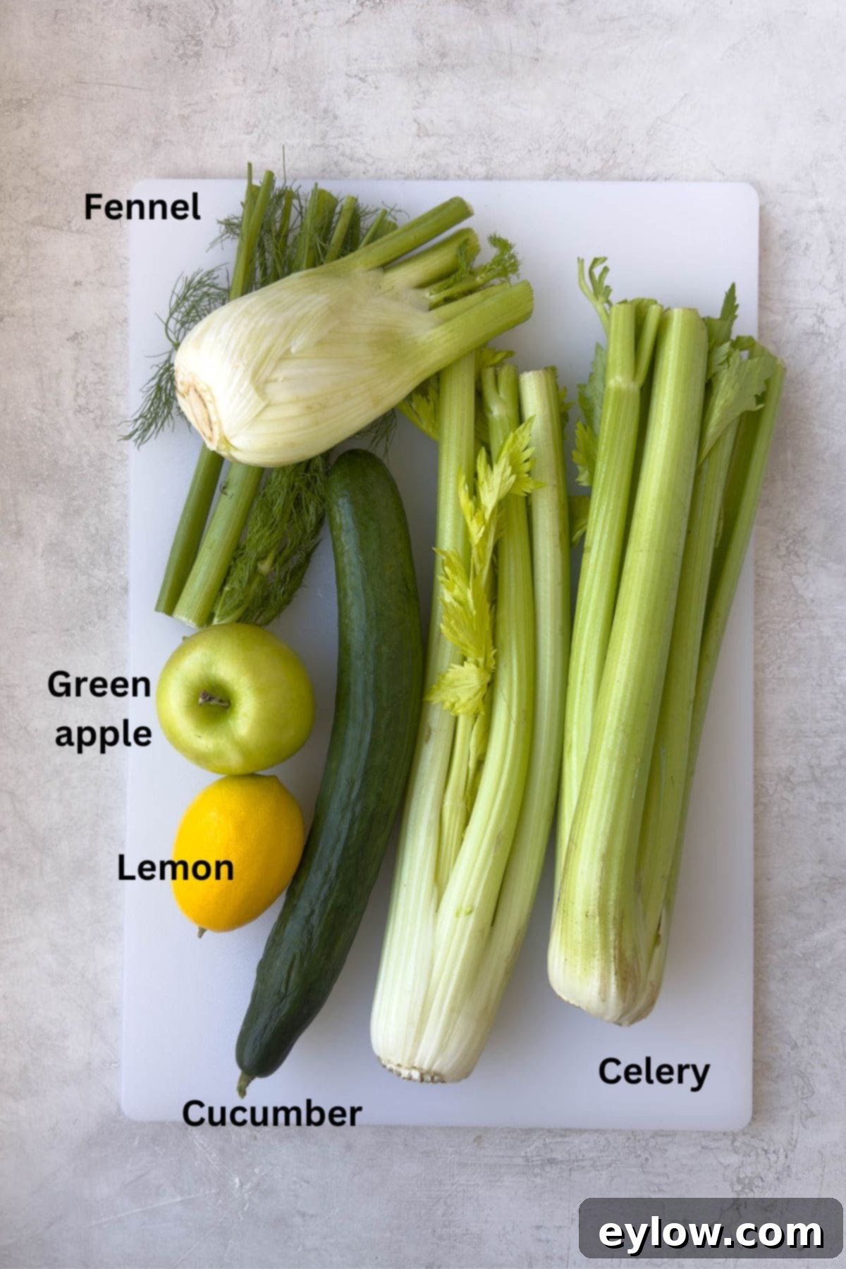 Crisp Green Elixir 3 Ingredients for a green juice with celery, cucumber, lemon, green apple, and fennel.