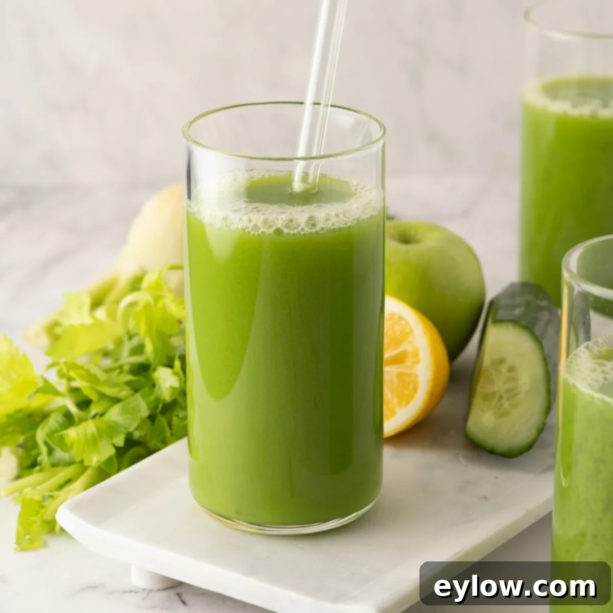 Crisp Green Elixir 8 Glasses of bright green, healthy cucumber, celery vegetables juice.