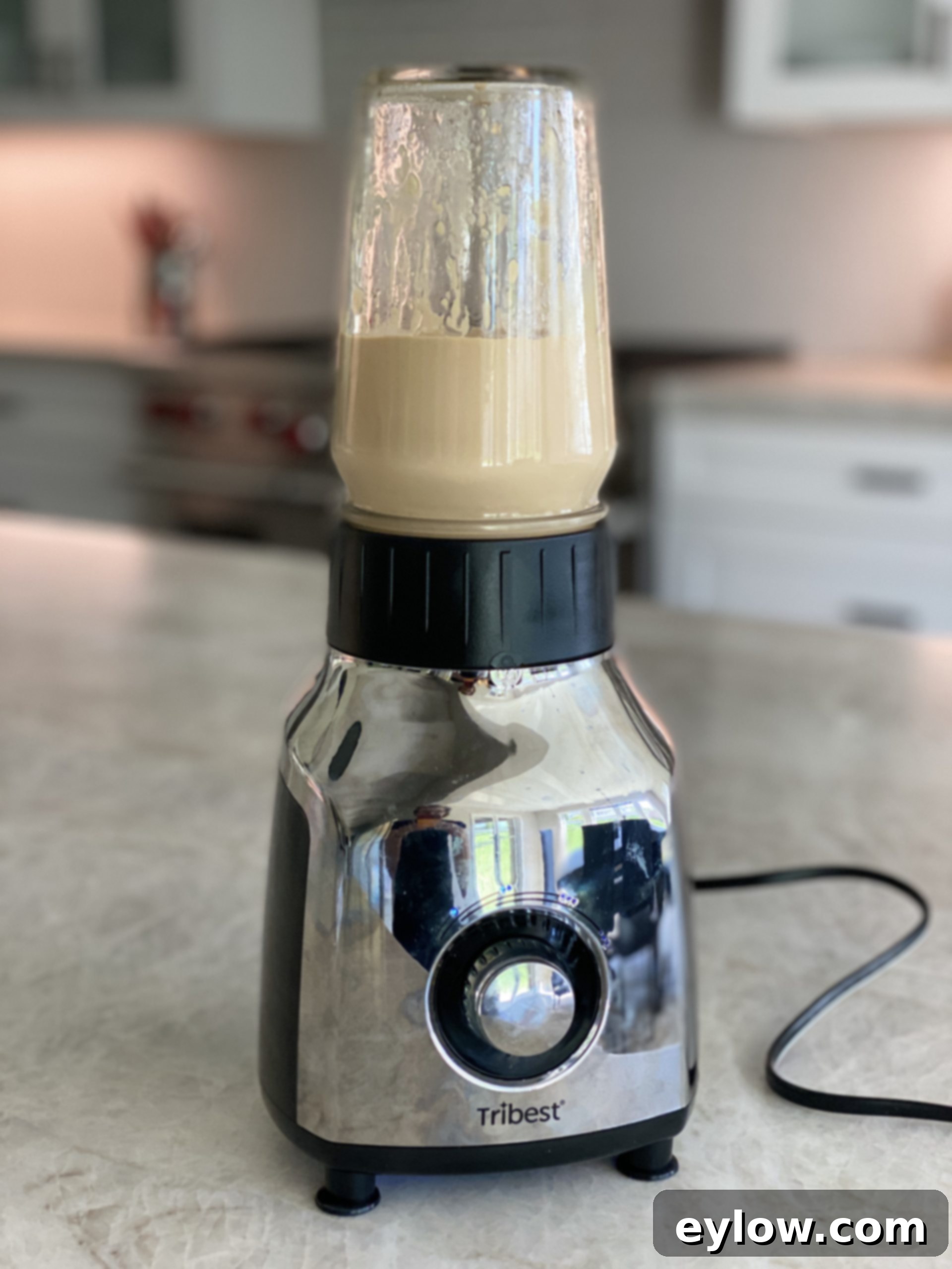Creamy tahini dressing being prepared in a small blender.