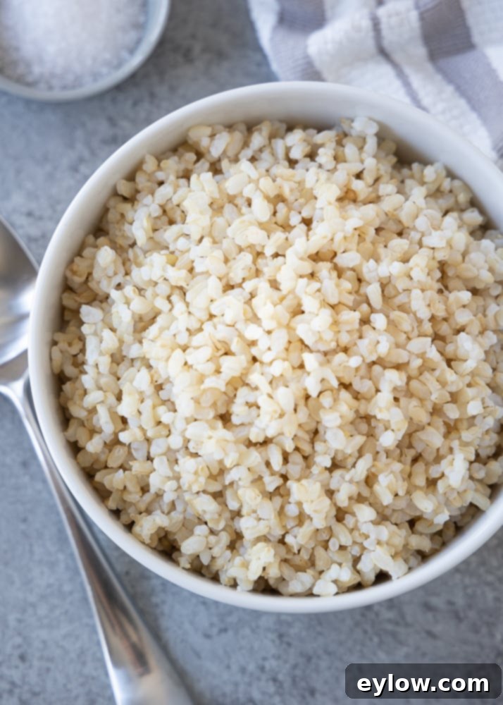 Minimizing Arsenic in Your Rice 2 brown rice in white bowl | afoodcentriclife.com