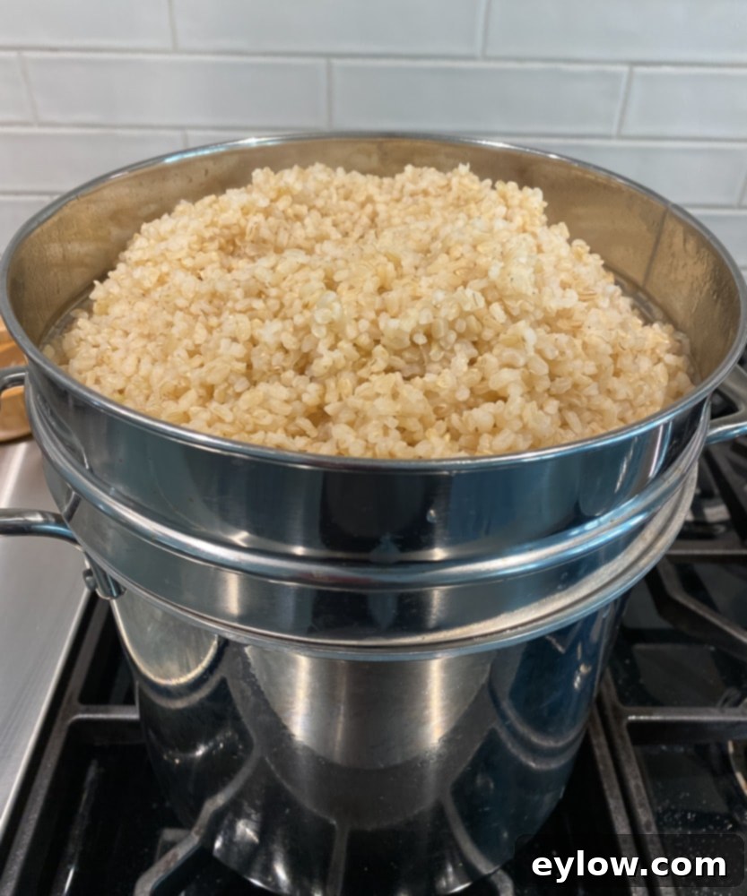 Minimizing Arsenic in Your Rice 4 brown rice in in colander | afoodcentriclife.com