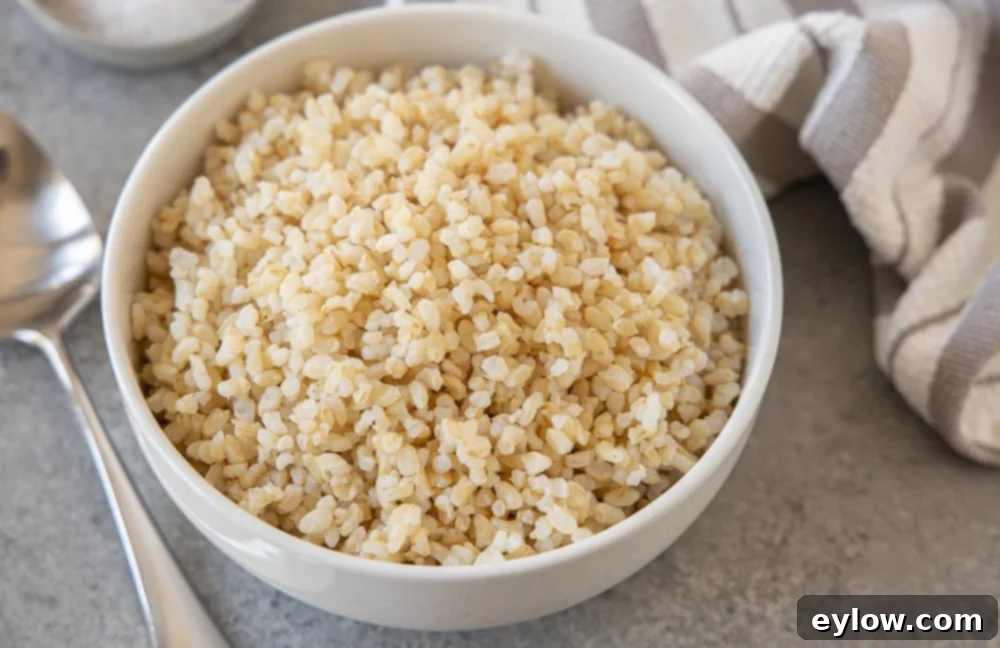Minimizing Arsenic in Your Rice 6 brown rice in white bowl | afoodcentriclife.com
