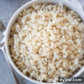 Minimizing Arsenic in Your Rice 7 brown rice in white bowl | afoodcentriclife.com