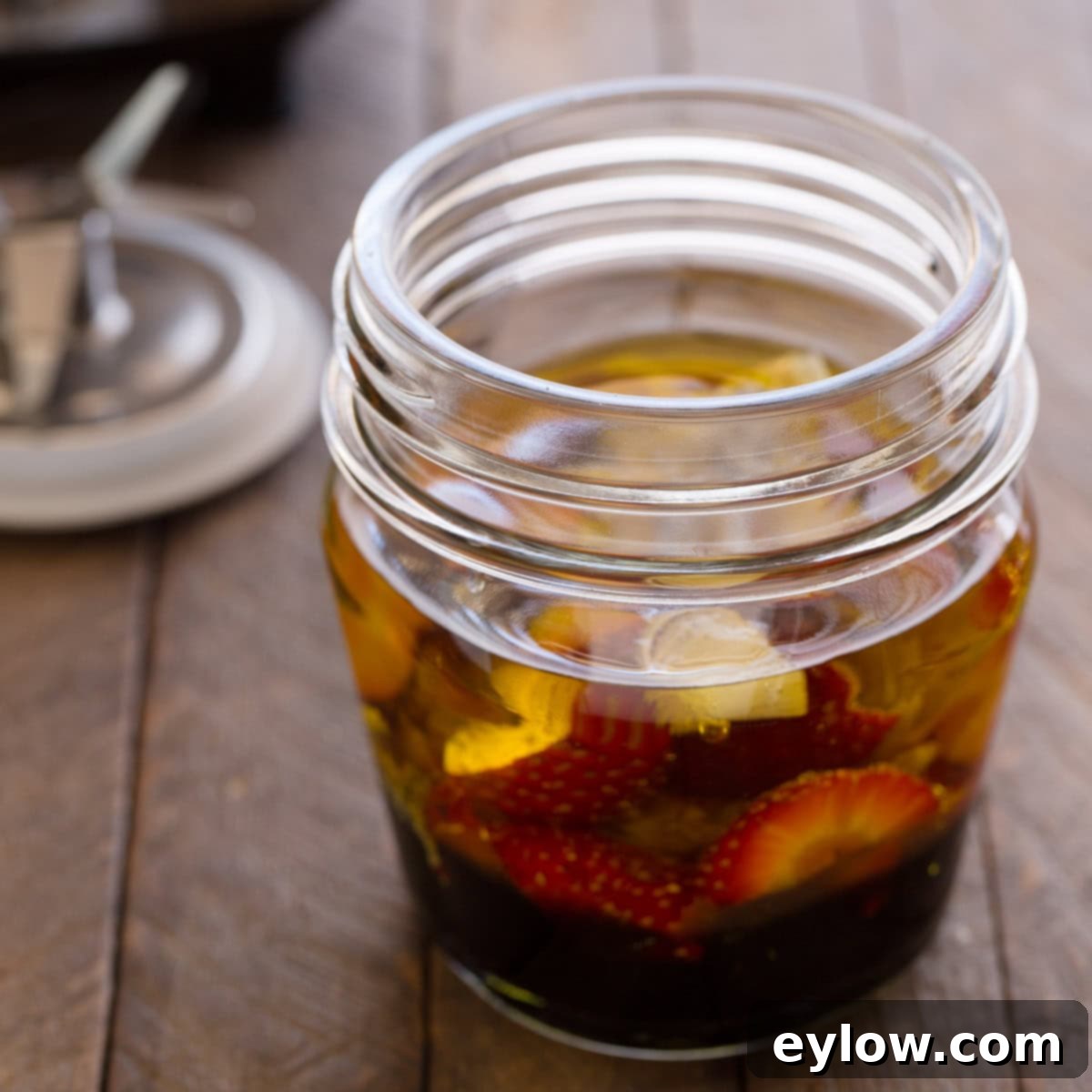 Ingredients for a strawberry vinaigrette in a blender container before blending.