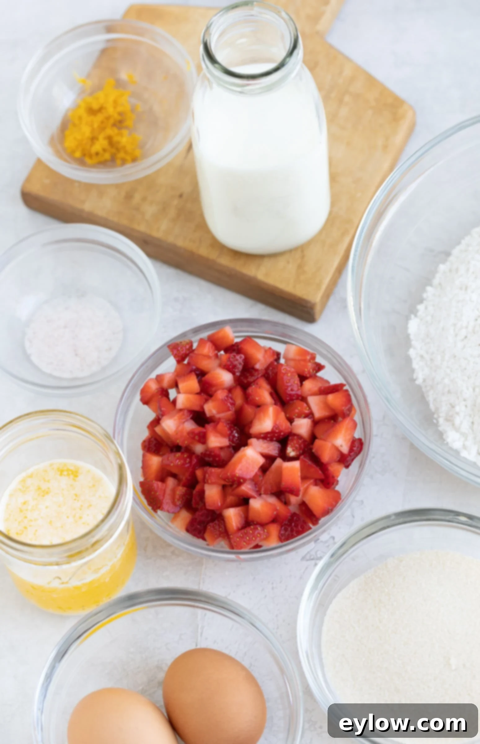 Fluffy Gluten-Free Strawberry Muffins 3 Muffin ingredients in small prep bowls on the counter.