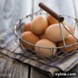Golden Cheesy Polenta with Poached Eggs 7 A basket of fresh brown eggs, indicating the quality needed for perfect poached eggs.