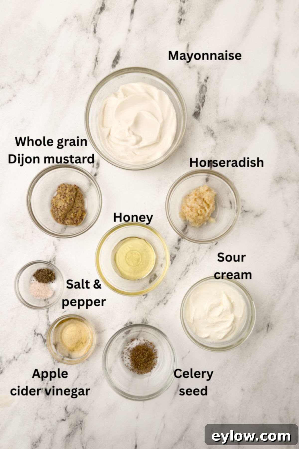 Quick and Creamy Coleslaw 4 Coleslaw dressing ingredients in small glass prep bowls on the counter.