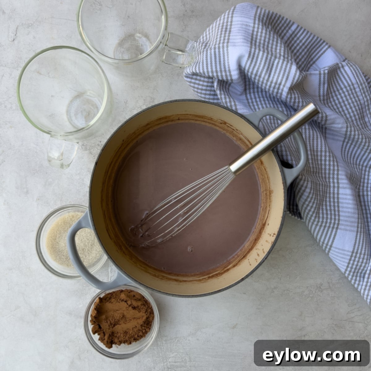 Easy Boozy Hot Chocolate 5 Mixing hot chocolate in a pot with whisk.