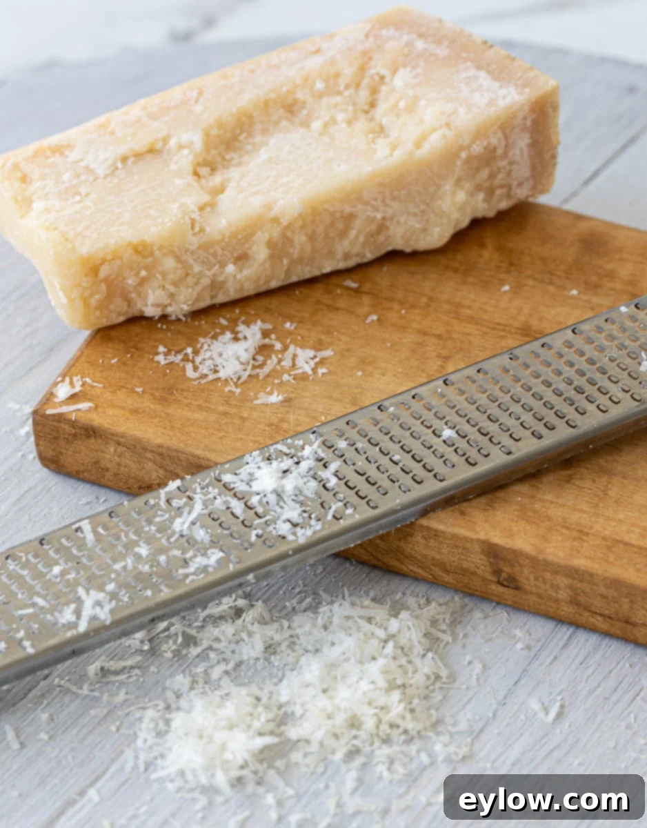 Grated Parmesan cheese with microplane zester.