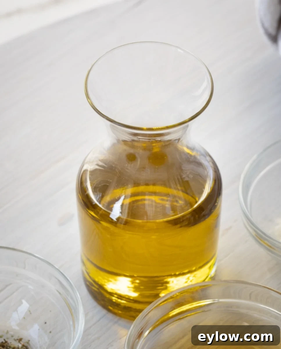 golden olive oil in a cruet.