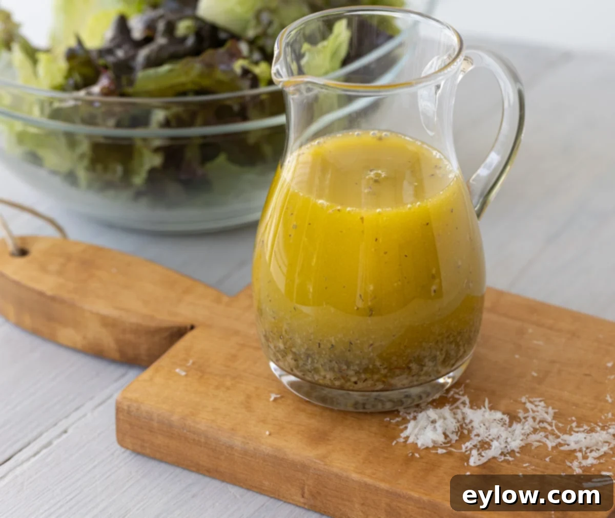 Italian dressing in small pitcher.