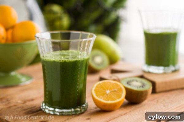 Revitalizing Green Elixir 3 Close-up of vibrant green juice in a glass, ready to drink, highlighting freshness and health benefits