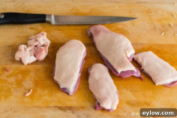 Step-by-step: How to Trim Duck breast, removing excess fat around the edges.