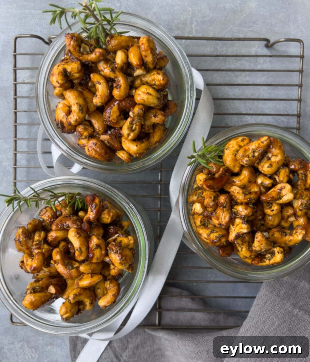 Maple Glazed Sweet and Spicy Cashews 8 Three jars of maple cashews with ribbon, great for gifts. Three glass mason jars filled with maple roasted cashews are decorated with festive ribbons, ready for gifting.