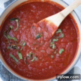 Pot full of rich homemade marinara sauce.