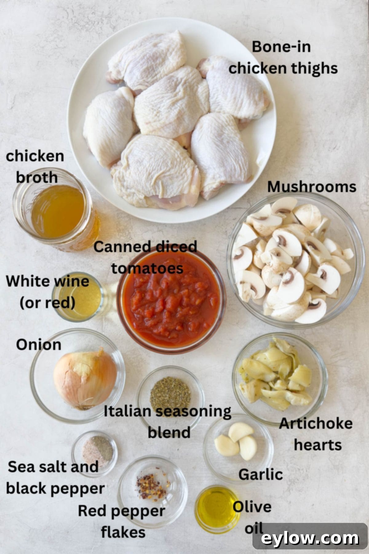 Effortless One Pan Italian Chicken Thighs 3 Ingredients for Italian chicken thighs in prep bowls on a gray counter.