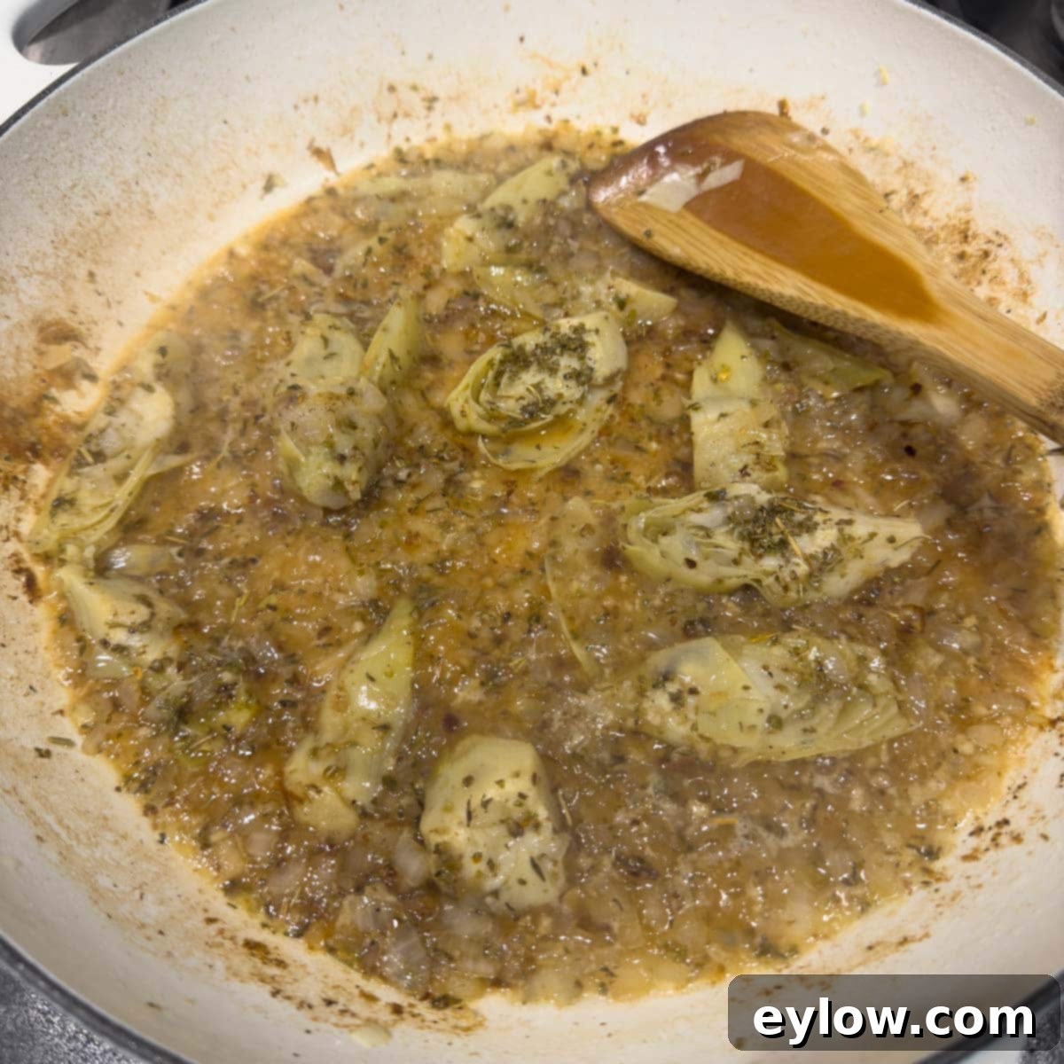 Effortless One Pan Italian Chicken Thighs 8 Deglazing the pan with wine and broth for a tasty sauce.