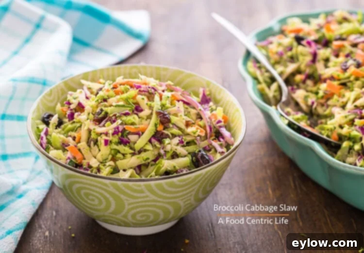 Creamy Apple Cider Crunch Slaw 2 Freshly prepared broccoli cabbage slaw in serving bowls, ready for a meal.