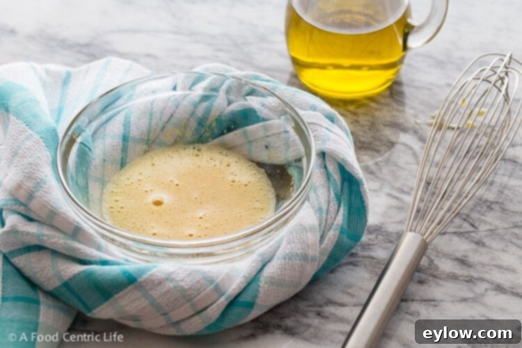 A small bowl nestled in a dish towel to prevent slipping.