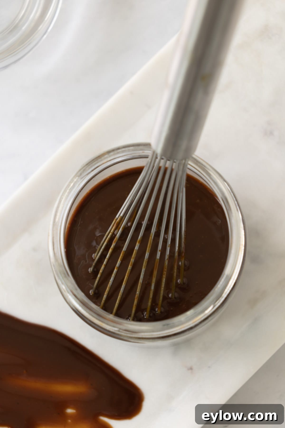 Homemade Gluten-Free Hoisin 5 Top down photo of deep brown hoisin in a jar after mixing.