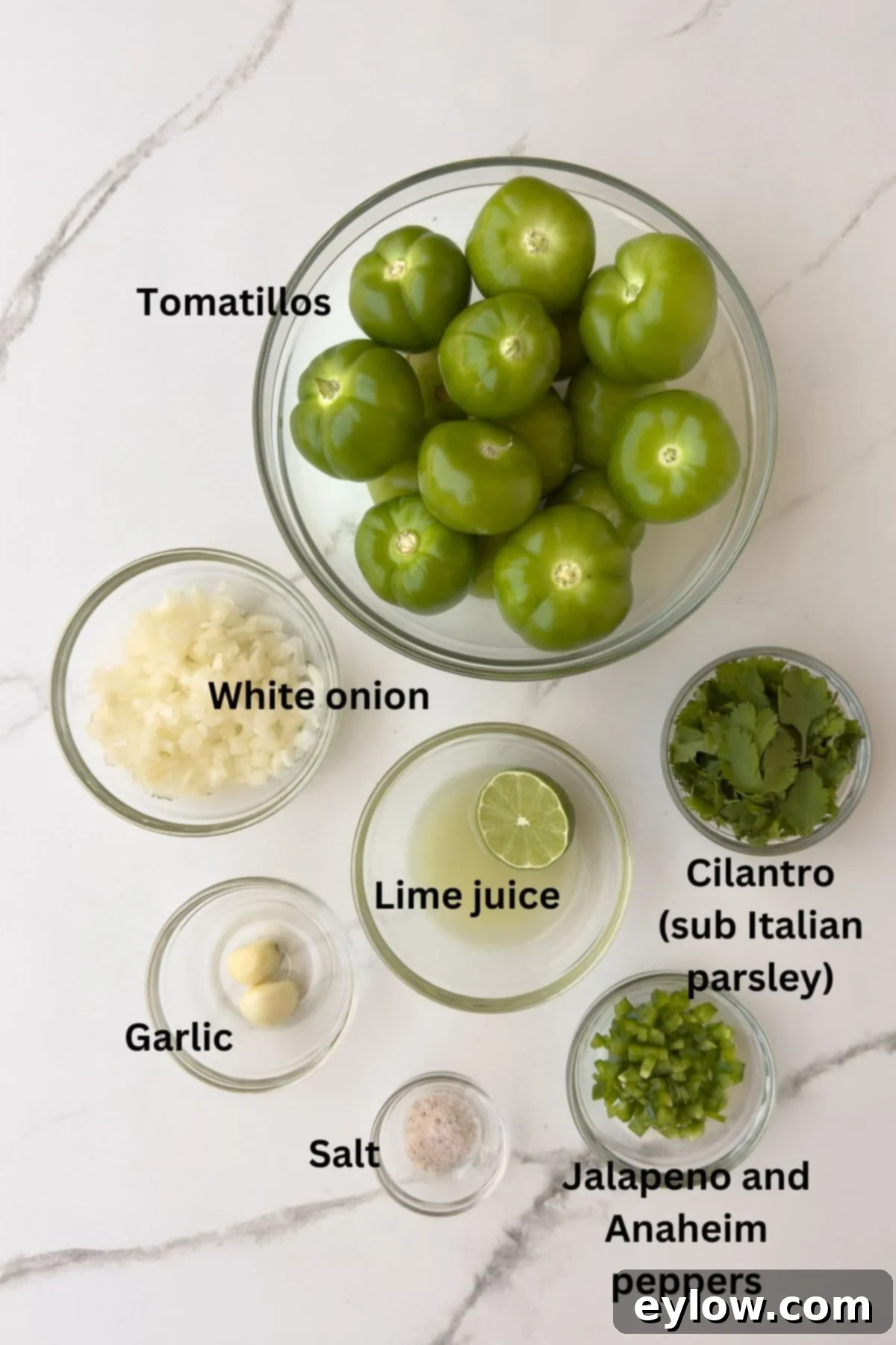 Ingredients for salsa verde in bowls on the counter. 