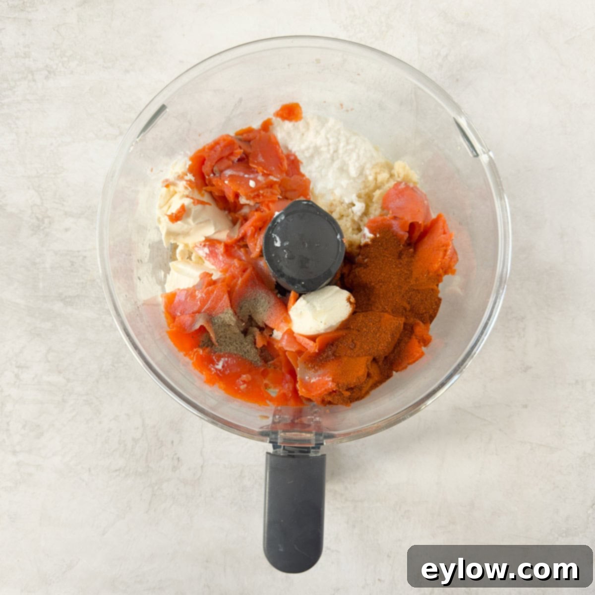 Ultimate Creamy Smoked Salmon Dip 4 Smoked salmon, cottage cheese, cream cheese, spices, and prepared horseradish are placed into the workbowl of a food processor, ready for blending.