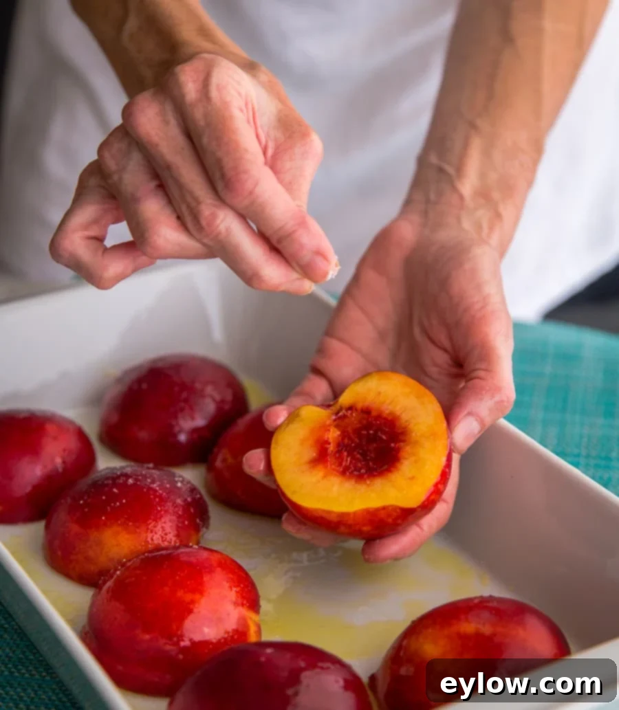 Blushing Nectarine Goat Cheese Crostini 3 Sprinkling halved and pitted nectarines with salt in a casserole dish for baking.