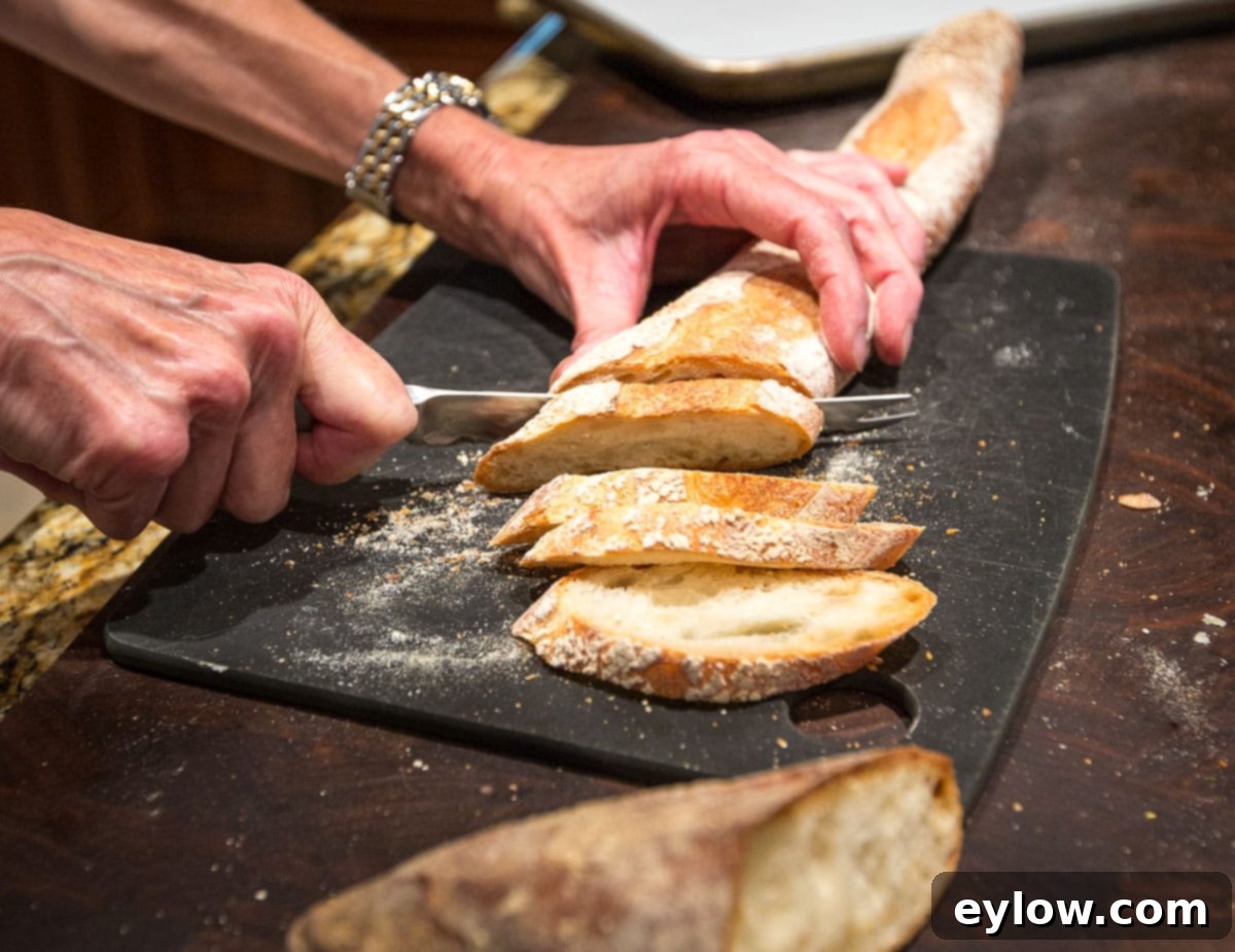 Cutting Baguette Slicing a baguette crosswise into crostini for appetizers.