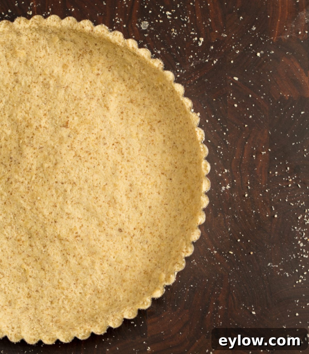 A beautifully golden-baked almond flour and coconut flour tart crust, perfectly formed and ready to be filled with your favorite sweet or savory delights.