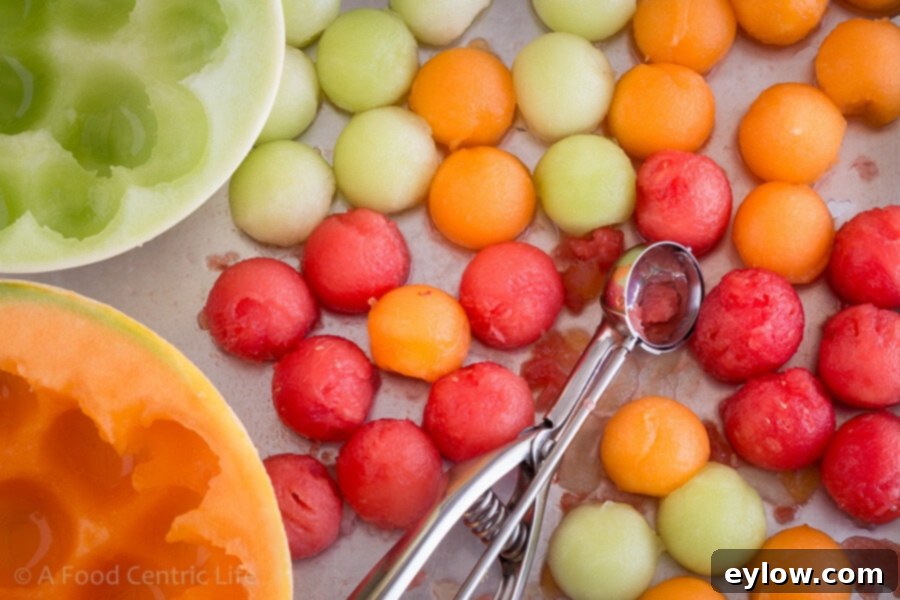 Melon Medley Skewers 4 Close-up of Melon Kabobs on a platter | AFoodCentricLife.com