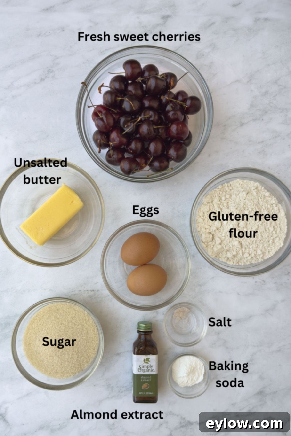 Ingredients for cherry cake on the counter in bowls.