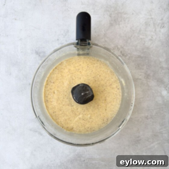 Next steps in making the almond cake batter in a food processor, smooth batter. 